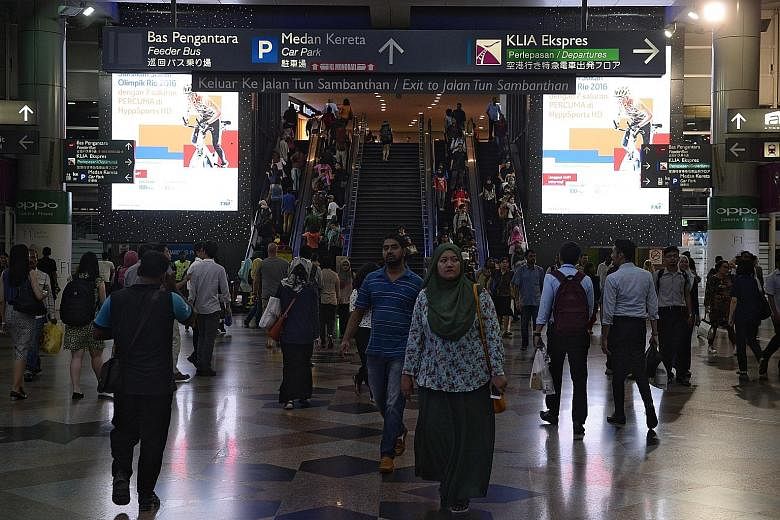 Commuters at KL Sentral railway station in Kuala Lumpur, one of the terminals for the Kuala Lumpur-Singapore high-speed rail project. The project is under review following the election of a new government in Putrajaya led by Malaysian Prime Minister 