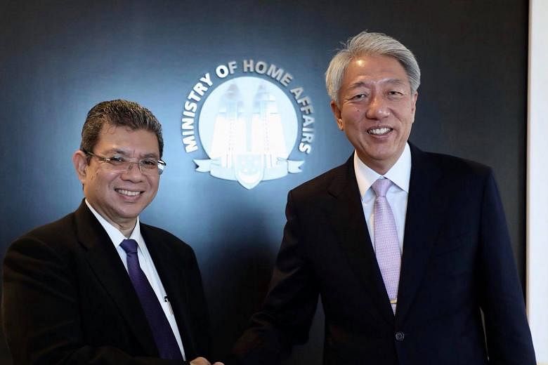 Visiting Malaysian Foreign Minister Saifuddin Abdullah meeting Deputy Prime Minister Teo Chee Hean yesterday. Datuk Saifuddin was in Singapore on a two-day introductory visit.