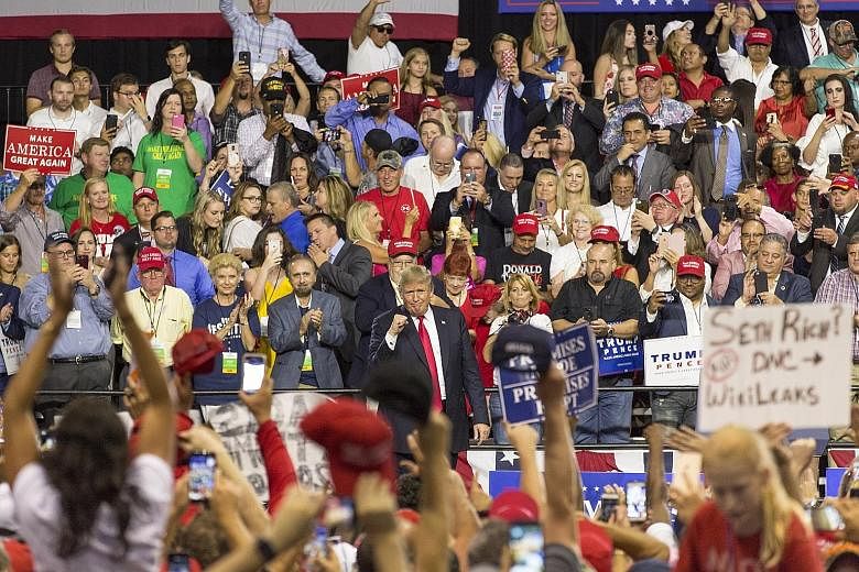 US President Donald Trump at a rally in Tampa, Florida, on Tuesday, drumming up support for his agenda and Republican candidates in the midterm elections in November. Members of Congress who had been briefed by Facebook on the new coordinated politic