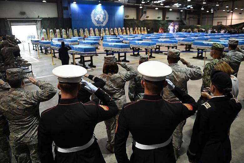 A ceremony at Osan Air Base in Pyeongtaek, South Korea, yesterday to mark the return of the remains of US soldiers. The return marks a partial fulfilment of an agreement reached between the US and North Korea. .