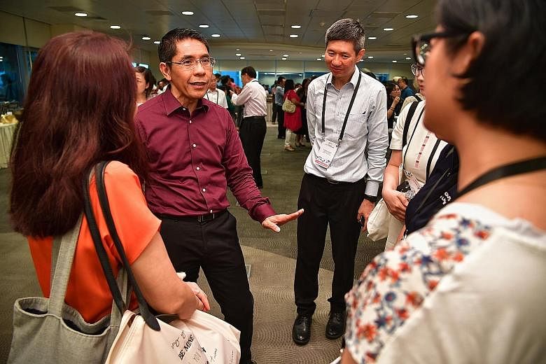 The South East Community Development Council (CDC) has set up a $200,000 grant to encourage more ground-up community projects. South East District Mayor Maliki Osman (in purple) announced the new grant at the CDC's annual conference held at the NTUC 