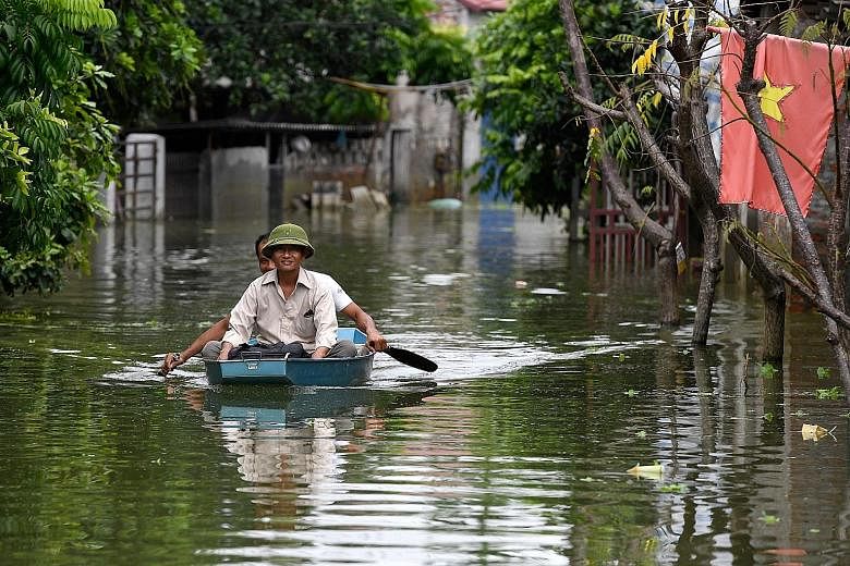 Streets in Hanoi's suburban Chuong My district have been turned into waterways after heavy rain over the past 10 days flooded the area. Reports say that more than 6,000 people have been evacuated from the area, with more evacuations possible in the c