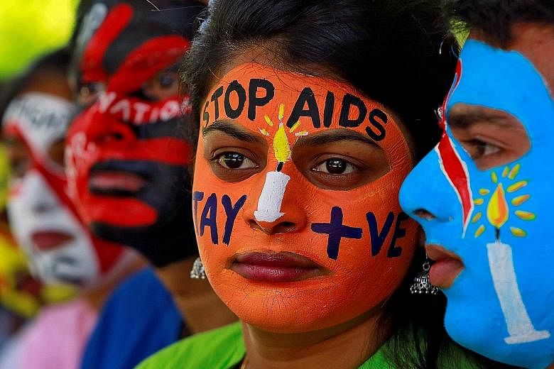 Students with their faces painted with messages during an HIV/Aids awareness campaign to mark the International Aids Candlelight Memorial in the Indian city of Chandigarh in May. India wants to reduce new HIV infections by 75 per cent between 2010 an