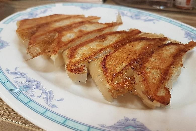 Grandma's Fish Maw Soup features a handmade fishcake rolled into a rosette. These pot stickers taste good even when they are cold.