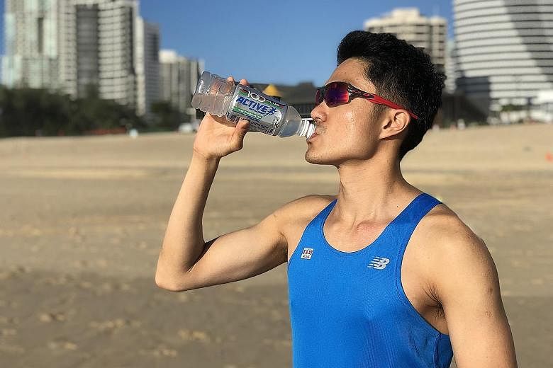 Mok Ying Ren hydrating himself with the non-carbonated 100Plus Active, his preferred choice for training and races. 100Plus is the official hydration partner for the Sept 23 ST Run.