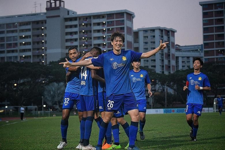 Hougang United players are delighted after Chang Jo-yoon's (front) third goal at the Bedok Stadium yesterday. Hougang beat an injury-hit Geylang International 3-0.