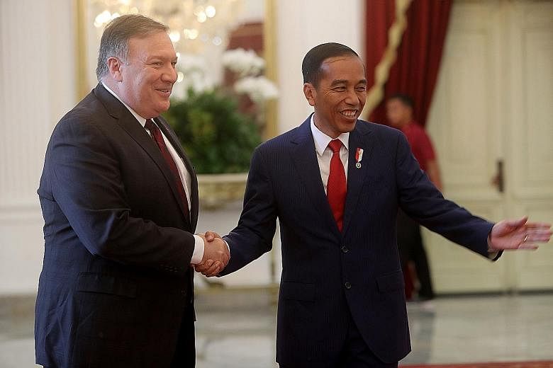 Indonesian President Joko Widodo meeting US Secretary of State Mike Pompeo at the presidential palace in Jakarta yesterday. Mr Joko expressed to Mr Pompeo his hope that a US preferential tariff scheme for Indonesia would be retained.