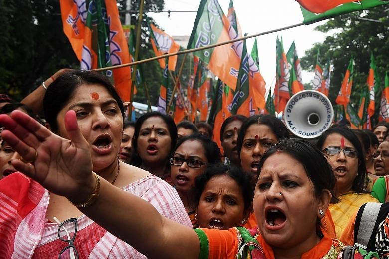 Bhartiya Janata Party activists shouting slogans last Thursday during a rally in Kolkata in support of the publication of the first complete draft of the National Register of Citizens, and against what they say was illegal immigration from Bangladesh