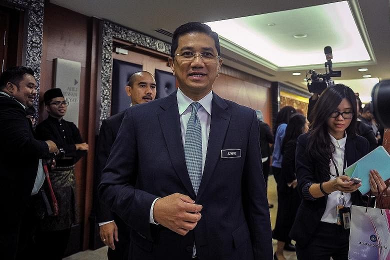 Economic Affairs Minister Mohamed Azmin Ali told reporters outside Malaysia's Parliament yesterday that he was in Singapore to visit Malaysian Home Minister Muhyiddin Yassin but also took the opportunity to meet some senior officials.