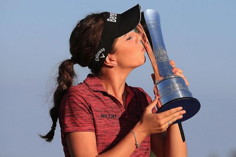 England's Georgia Hall shot a five-under 67 to win the British Open on Sunday. She finished on 17 under, two clear of overnight leader Pornanong Phatlum of Thailand.