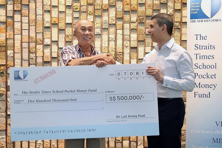 Mr Loh Kiong Poot presenting a mock cheque to Straits Times School Pocket Money Fund chairman and Straits Times editor Warren Fernandez. Mr Loh's struggles in his early years have motivated him to help needy children.