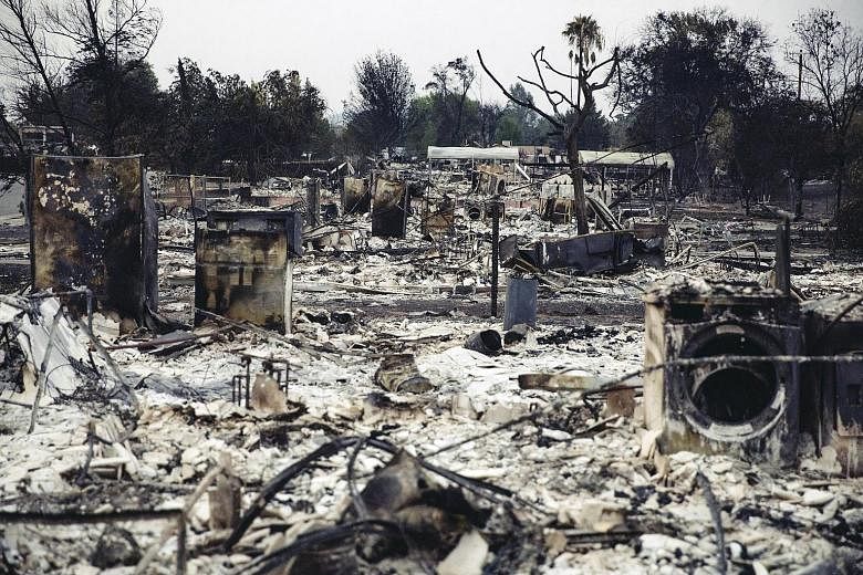 The charred remains of a row of houses in the Lake Keswick Estates area, which was devastated by the Carr Fire, in Redding, California, last Thursday. The fire, which broke out on July 23, was 47 per cent contained. Meanwhile, the Mendocino Complex b