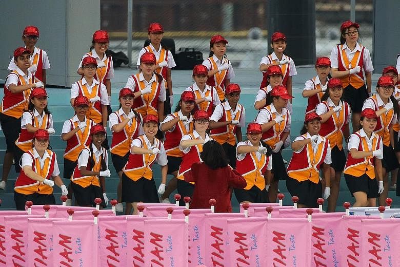 The iconic combined school choir makes a comeback after a five-year hiatus, singing a medley of classics to celebrate Singapore's 53rd birthday.