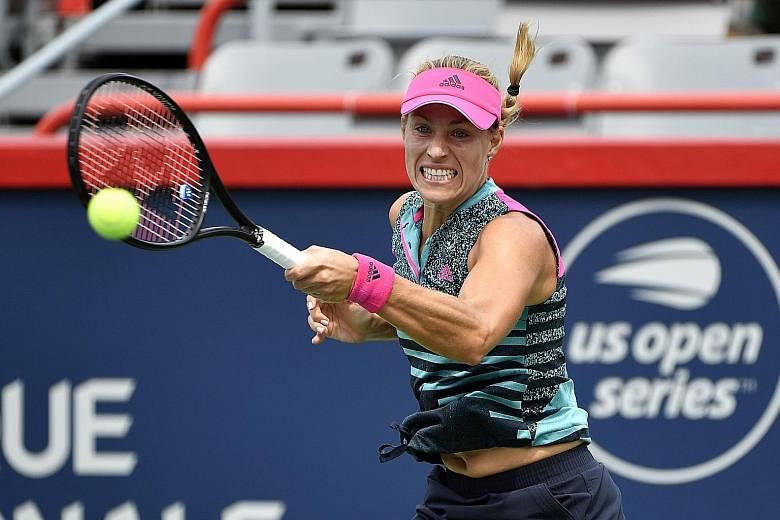 Germany's Angelique Kerber suffers on the hard court in her first match since her Wimbledon triumph, losing 6-4, 6-1 to France's Alize Cornet in the second round of the Rogers Cup.