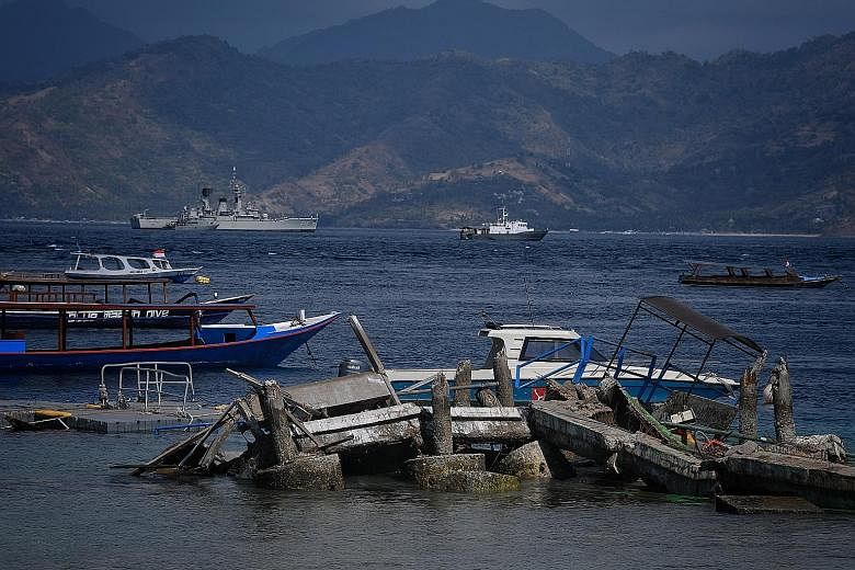Gili Trawangan's jetty also collapsed, forcing incoming boats to land on the beach to evacuate tourists or bring in fresh supplies. A collapsed portion of a hotel on Gili Trawangan, off Lombok, on Wednesday. Sunday's earthquake cut off electricity an
