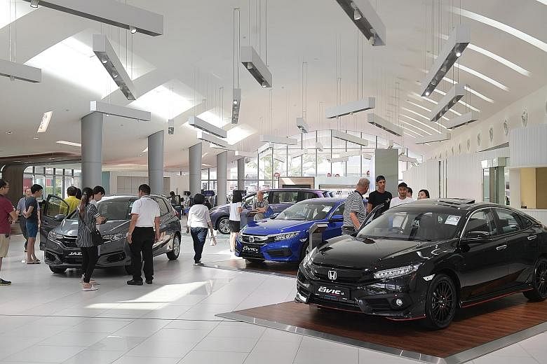 Car showrooms were packed with potential buyers after COE prices dipped in late June. However, if motor vehicle sales were excluded, retail takings in June would have just inched up a marginal 0.2 per cent.