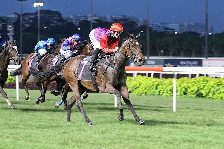 Jockey Alysha Collett steering the Clements-trained Viola Da Terra to her first win on her second race start at Kranji yesterday.