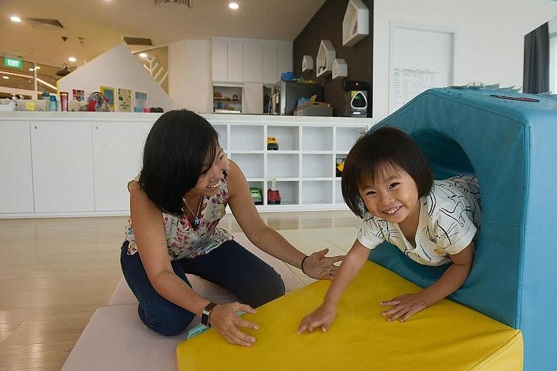 (Above) Three-year-old Terese Pereira playing with her mother, photographer Alexandria Neoh, in the co-working space at Trehaus. Trehaus sets itself apart by offering a family-friendly co-working space where the adults can do their work in one room (