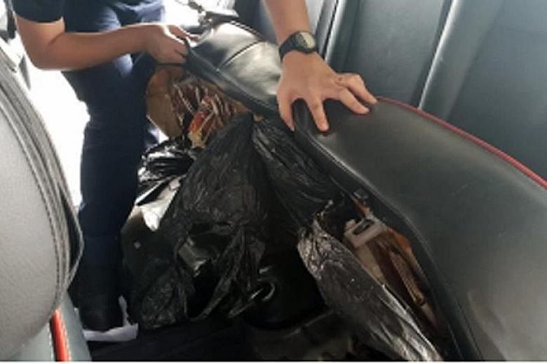 It seemed like tobacco was hidden in every part of the car - (from left) under the seats, in the rear bumper and even in the spare tyre - when Immigration and Checkpoints Authority (ICA) officers foiled a smuggling attempt at Woodlands Checkpoint on 