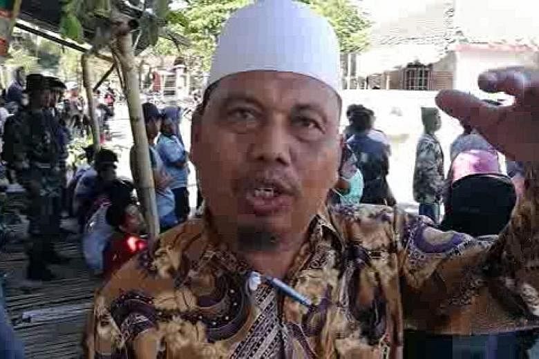Mr Narto Aryadi (above) slowly chipped his way out of a collapsed mosque with a hammer from a rescuer. School teacher Ayub Yusuf was shaken like a rag doll and blown off the floor he was sitting on. The Jabal Nur mosque in Lading-Lading which collaps