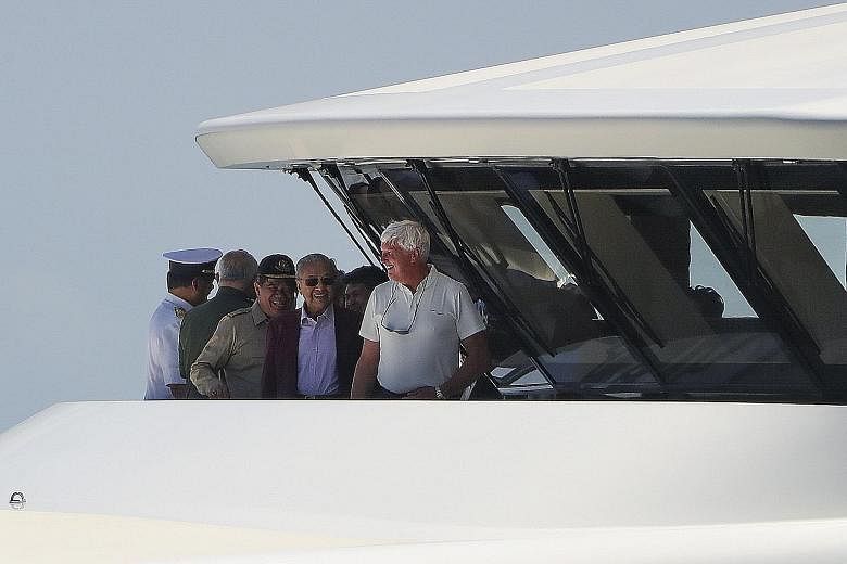 Equanimity's "super luxurious" facilities (left) stunned Dr Mahathir Mohamad (above, centre) and Defence Minister Mohamad Sabu (third from left) during their tour of the vessel yesterday.