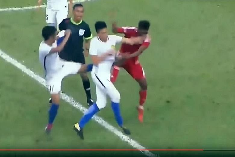 The brawl on Friday was triggered off by UAE midfielder Mohammad Khalfan Eto (in red) elbowing Malaysian defender Adib Zainuddin.