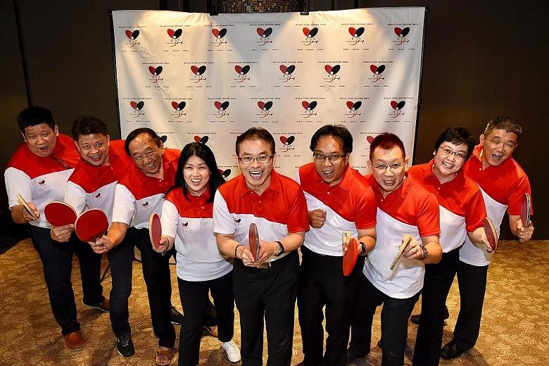 Toh Kian Lam (centre) and his team members running in the STTA election (from left) Bernard Tan, Eric Fong, Terry Tan, Patricia Kim, Ow Chee Chung, Marcus Tan, Wu Xiaowen and Andrew Tan.