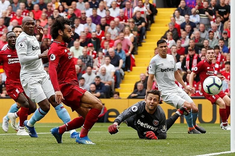 Mohamed Salah opens his and Liverpool's account for the season as he taps the ball past West Ham goalkeeper Lukasz Fabianski. Sadio Mane added a brace and Daniel Sturridge put the icing on the cake with a fourth.