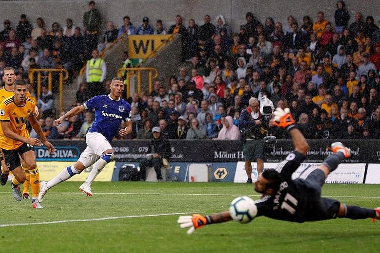 Everton's Richarlison scoring their second goal past Wolves custodian Rui Patrício. The Brazilian forward moved from Watford to Everton for £40 million (S$70 million) last month.
