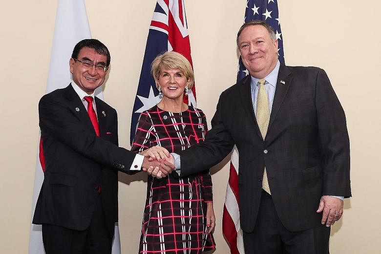 (From left) Japanese Foreign Minister Taro Kono, Australian Foreign Minister Julie Bishop and US State Secretary Mike Pompeo posing on Aug 4 before a trilateral meeting on the sidelines of the 51st Asean Foreign Ministers Meeting in Singapore.