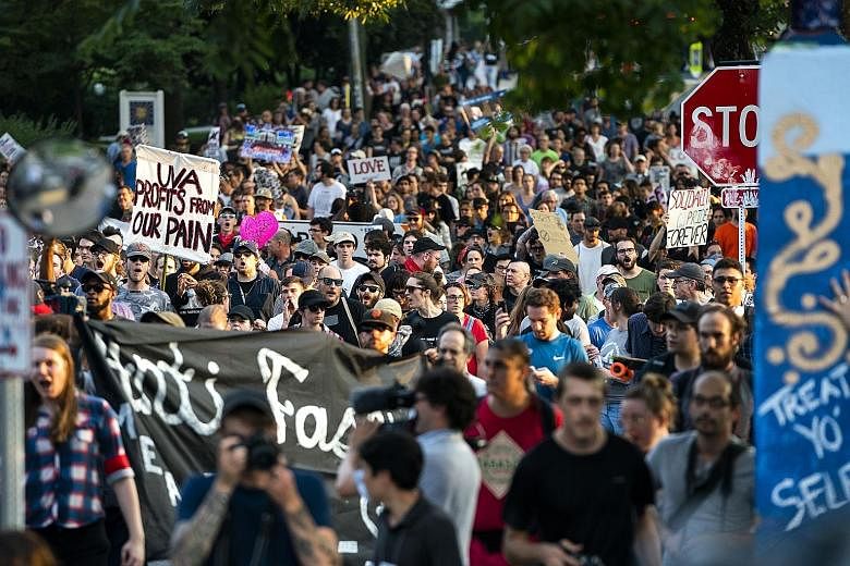 Students from the University of Virginia, along with residents and anti-fascists, marching last Saturday across campus at a "Rally for Justice" near downtown Charlottesville, Virginia, as the city marks the anniversary of last year's Unite the Right 