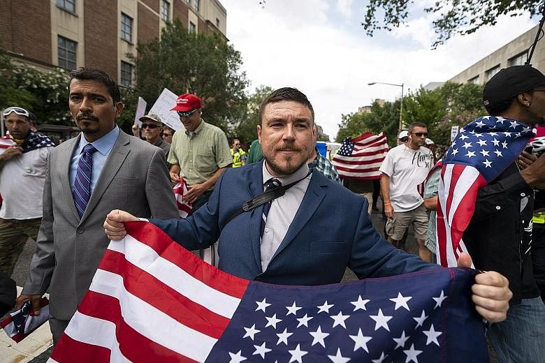 White supremacist Jason Kessler and members of the alt-right marching to the White House as part of the "Unite the Right 2" event on Sunday.
