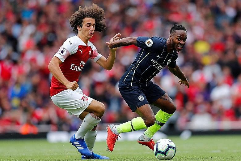 Manchester City forward Raheem Sterling fending off the challenge of Arsenal midfielder Matteo Guendouzi in the Premier League champions' 2-0 win at the Emirates Stadium on Sunday. The 23-year-old Sterling, whose opener for City was his 50th league g