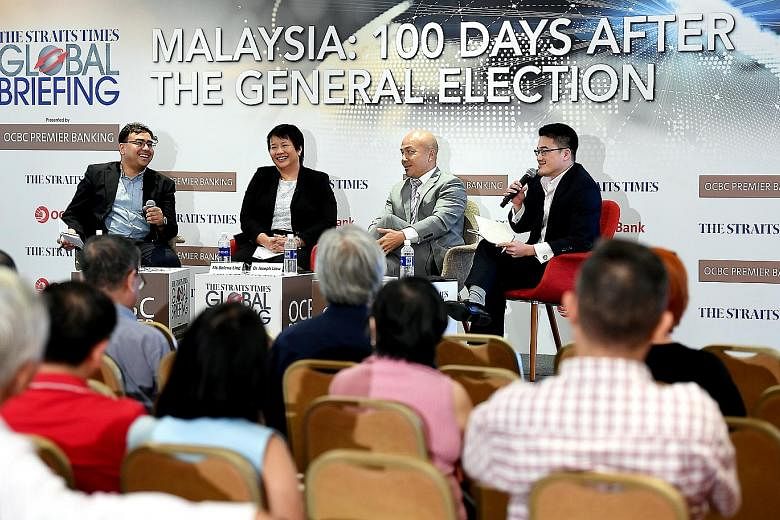 (From left) Straits Times foreign editor and panel moderator Zakir Hussain; OCBC Bank's head of treasury research and strategy Selena Ling; Professor Joseph Liow, dean of NTU's College of Humanities, Arts and Social Sciences and S. Rajaratnam School 