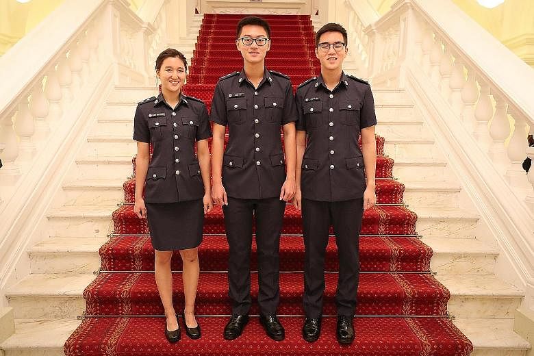 (From left) Ms Cammy Chua, Mr Alden Tan and Mr Stefan Liew at the Istana yesterday, where they were among 17 recipients who were awarded scholarships to pursue careers with the Home Team.