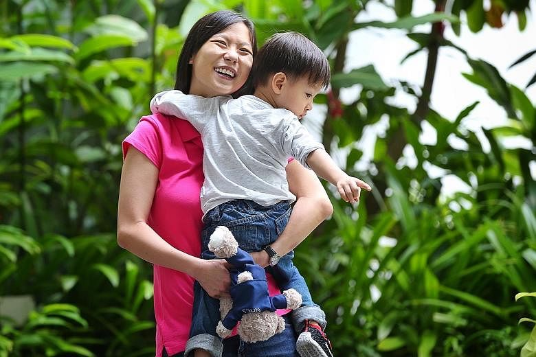 Ms Winnie Tan, 31, with her son Winson, two. She benefited from SGH's joint clinic scheme when she was expecting her first child three years ago. Ms Tan, who was born with two holes in her heart, had a difficult pregnancy. Supervision by doctors from