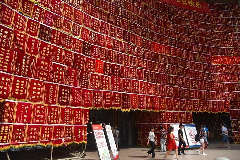 The facade of a hospital in Chongqing in China is adorned with pennants celebrating doctors in preparation for China's first Doctors' Day tomorrow. The holiday was approved by the State Council last year and is the fourth statutory professional holid