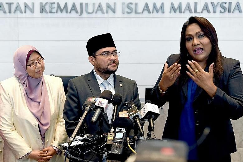 (From left) Deputy Minister in the Prime Minister's Department Fuziah Salleh; Datuk Dr Mujahid Yusof Rawa, Minister in the Prime Minister's Department (Religion); and transgender Nisha Ayub at Jakim on Aug 10.