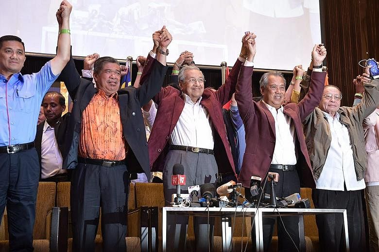 Tun Dr Mahathir Mohamad flanked by fellow Pakatan Harapan leaders (from left) Mohamad Sabu, Tan Sri Muhyiddin Yassin and Mr Lim Kit Siang on May 10. The indications are that while Dr Mahathir has largely retained his standing as a strongman leader, h