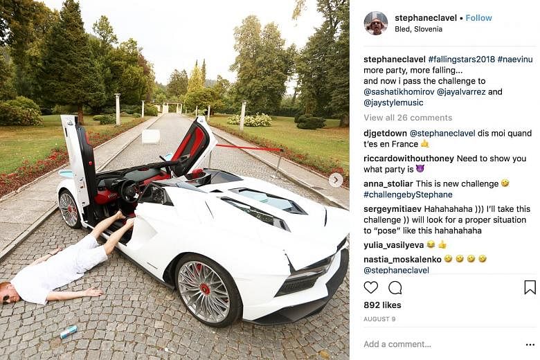 An Instagram user participating in the Falling Stars Challenge, where the goal is to lie on the ground in a dramatic fashion, as if you have just fallen to your death, while boasting about your wealth or status. The challenge is gaining popularity am