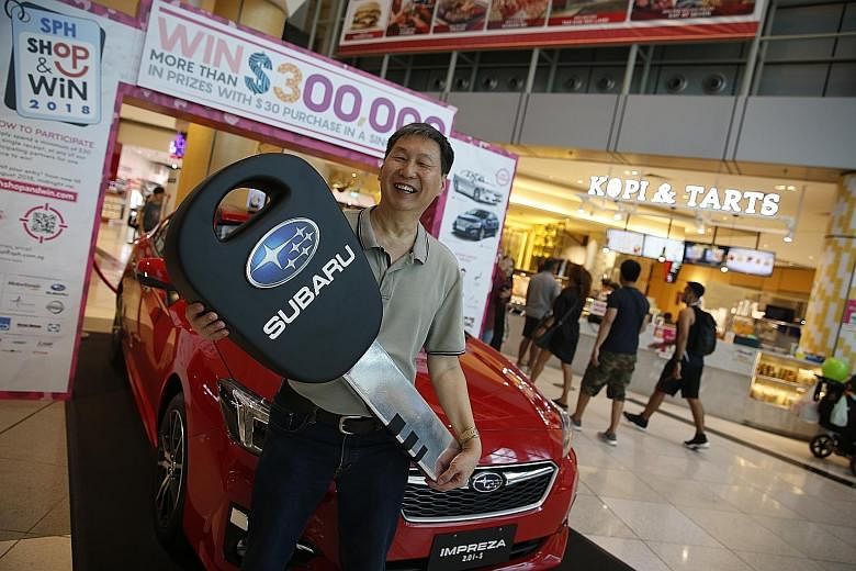 Mr Wong Chee Seng (above) and Mr Ho Kim Soon (right) took public transport to get to Suntec City yesterday for the annual Singapore Press Holdings (SPH) Shop & Win live prize draw, but they could soon be out on a new set of wheels. The two turned out