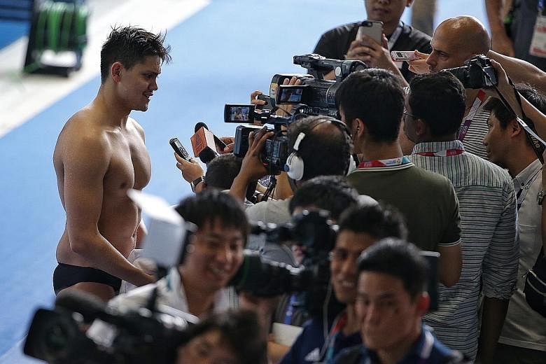 Joseph Schooling speaking to reporters at the Gelora Bung Karno Aquatic Centre. The swimmer's first Asiad event, the 50m freestyle, is on Tuesday.