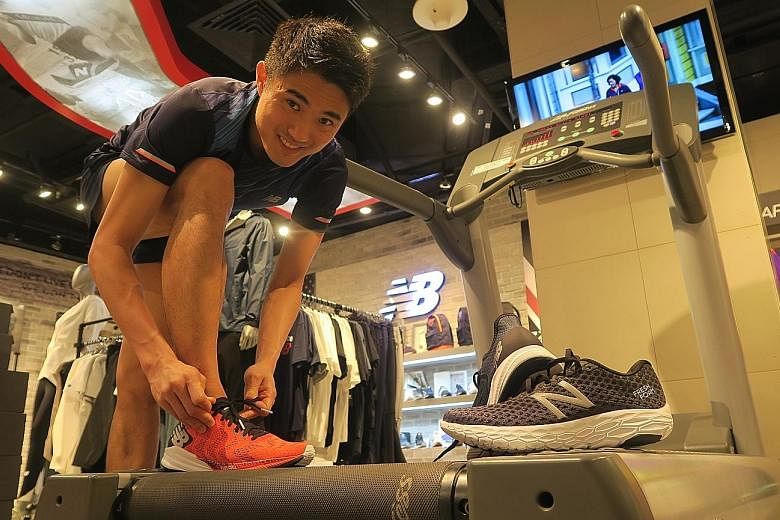 Mok Ying Ren preparing to try out New Balance's new line of running shoes on an in-store treadmill.