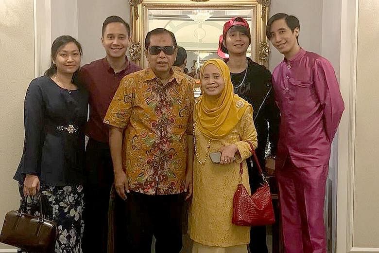 Mr Mashruddin Saharuddin and his wife Sumasni Sunar with (from left) Ms Nuraidah Azman, the fiancee of their son Naziruddin, who is next to her; and their two other sons Nazaruddin and Nizaruddin.