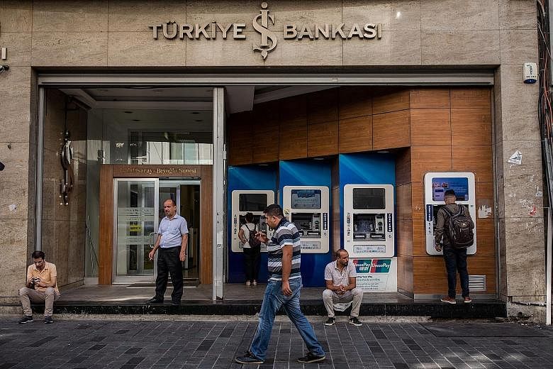 A branch of Turkiye Is Bankasi, Turkey's largest bank, in Istanbul. Markets are emerging from a week dominated by Turkey's spat with the United States, with the falling Turkish lira having an alarming effect on emerging market currencies However, mor