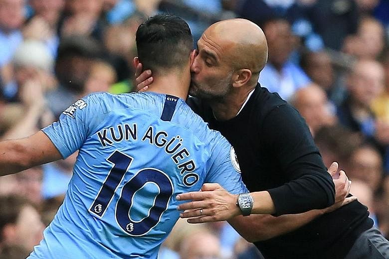 City manager Pep Guardiola kissing Sergio Aguero as the Argentinian striker leaves the pitch after Leroy Sane replaced him.