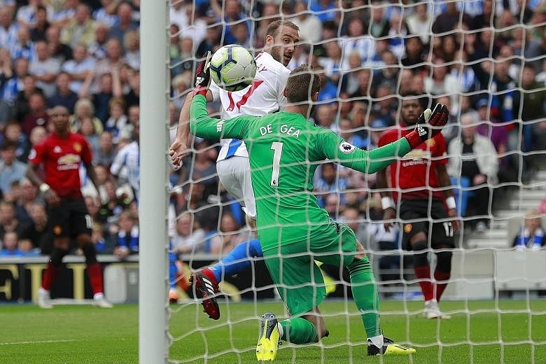 Brighton striker Glenn Murray scoring past Manchester United goalkeeper David de Gea in the 25th minute to give the home side the early lead in yesterday's Premier League clash. Barely two minutes had passed before defender Shane Duffy made it 2-0 wi