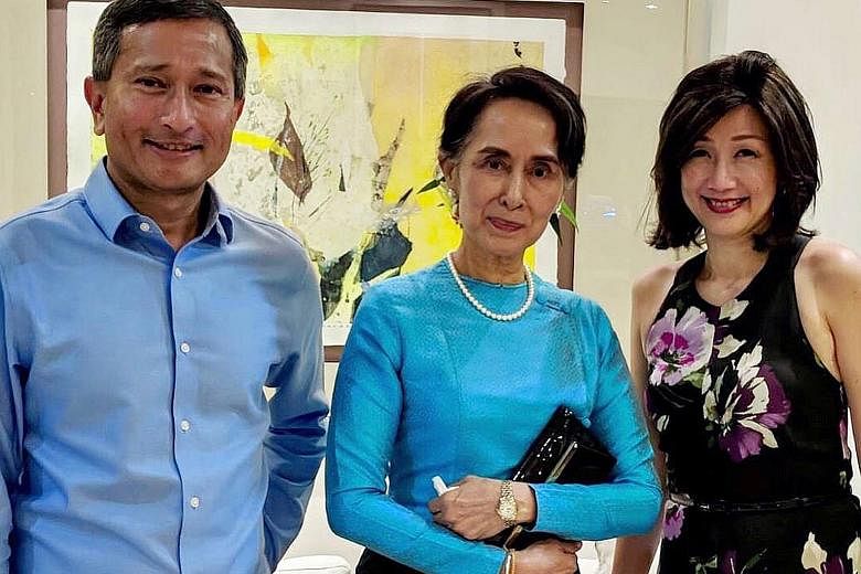 Above: Myanmar's State Counsellor Aung San Suu Kyi, who is here for a four-day working visit, was hosted to dinner yesterday by Foreign Minister Vivian Balakrishnan (left, with his wife) at his home. Dr Balakrishnan said in a Facebook post that it wa