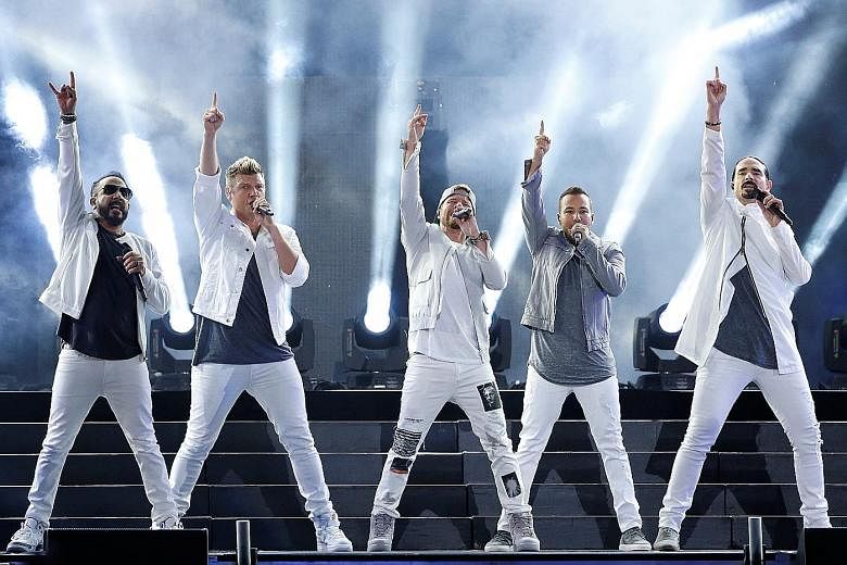 Backstreet Boys, in a June concert (above) in Los Angeles, cancelled their outdoor gig with boyband 98 Degrees in Oklahoma as a thunderstorm struck the concert venue.