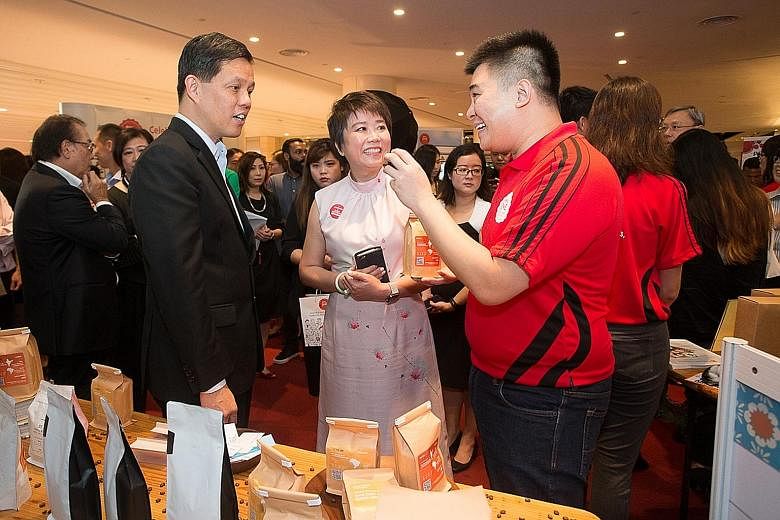 Trade and Industry Minister Chan Chun Sing and DBS group head of SME banking Joyce Tee with Cafebond.com co-founder Keyis Ng (right) at the launch event for the online portal under the 99%SME initiative.
